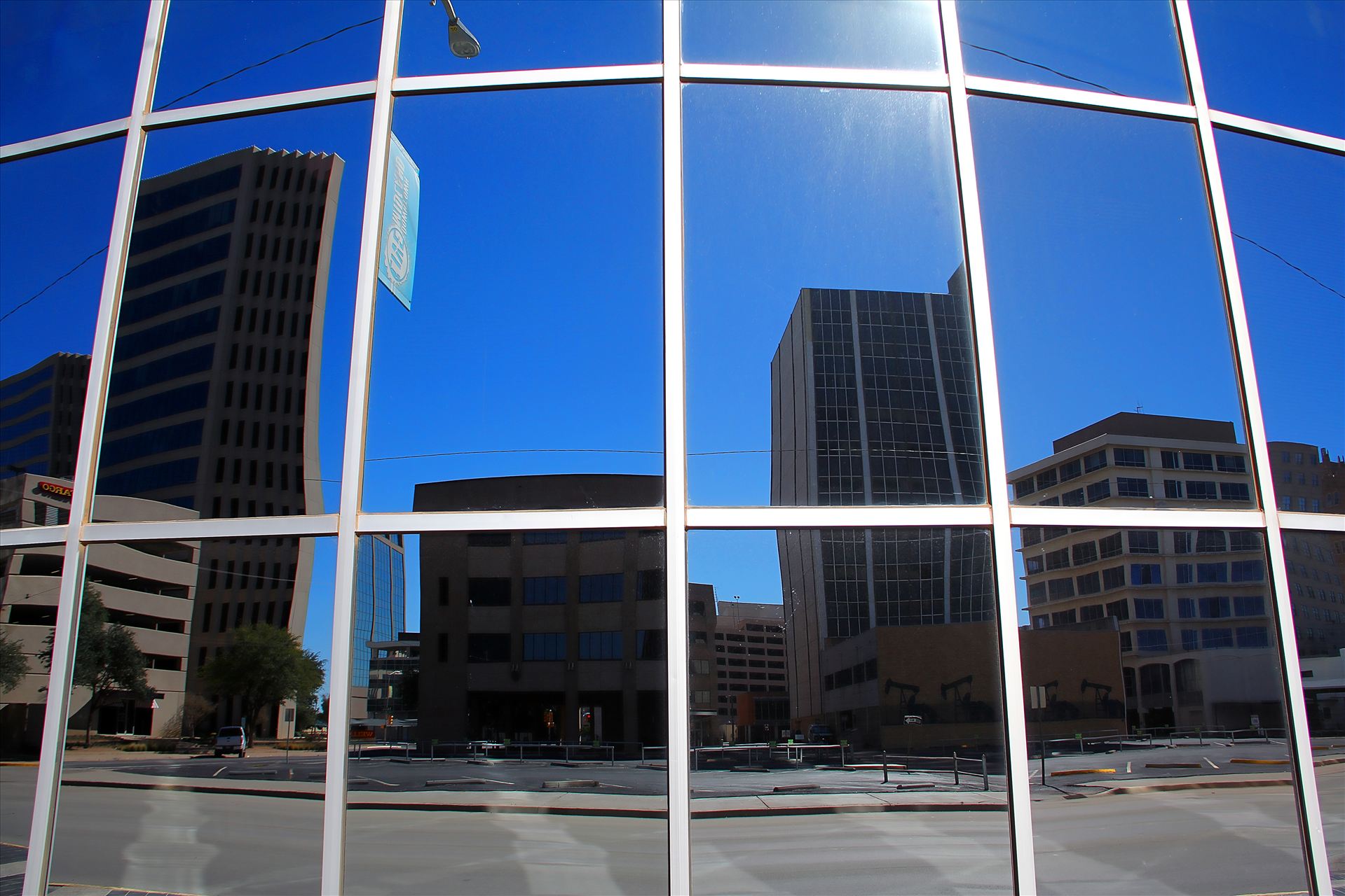 Reflection of Downtoan Midland, TX -  by David Verschueren