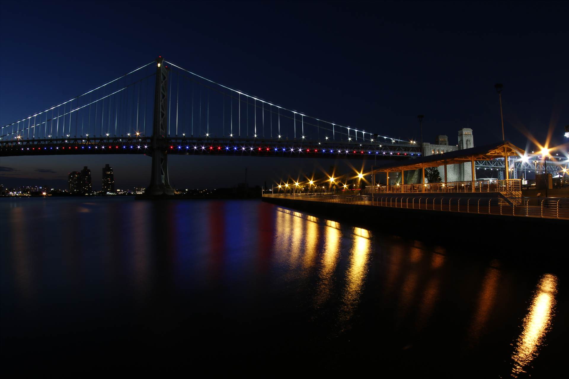 Ben Franklin Bridge to Camden, NJ -  by David Verschueren